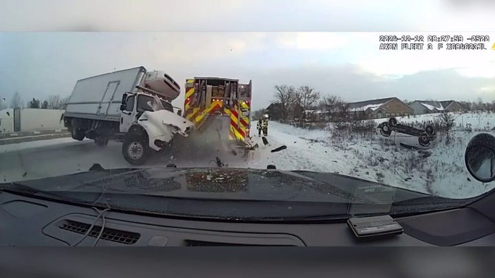 Out-of-control truck jackknifes first responder vehicles on icy highway in Michigan