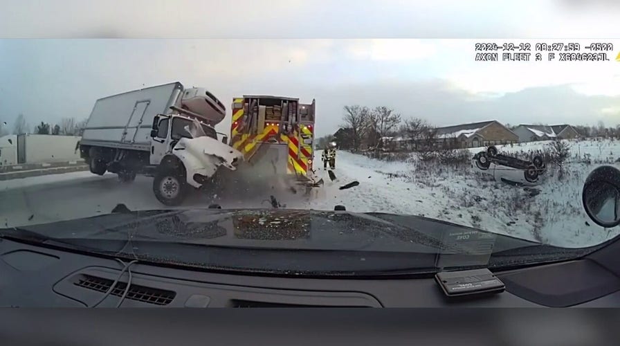Out-of-control truck jackknifes first responder vehicles on icy highway in Michigan