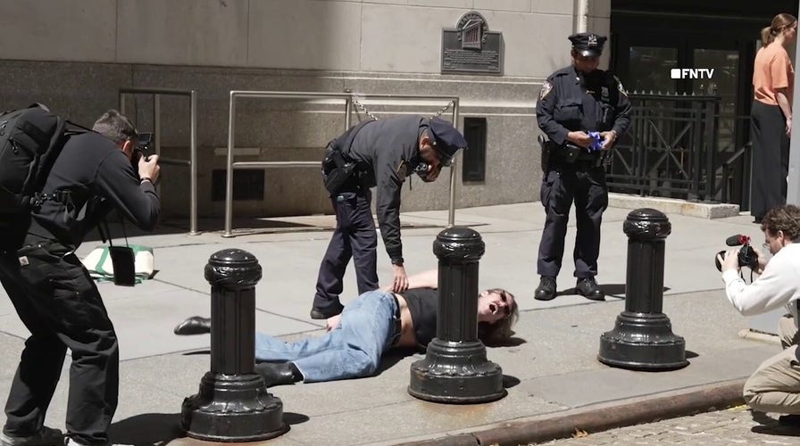 NYPD arrest anti-billionaire agitators trying to chain themselves to New York Stock Exchange