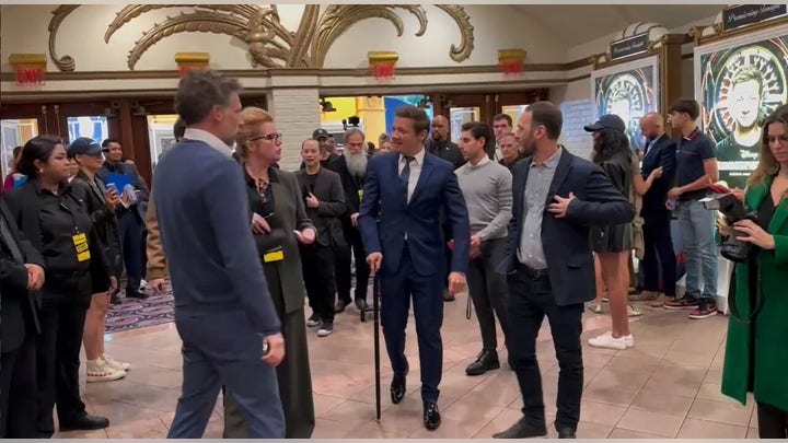 Jeremy Renner uses cane to walk into premiere of "Rennervations"