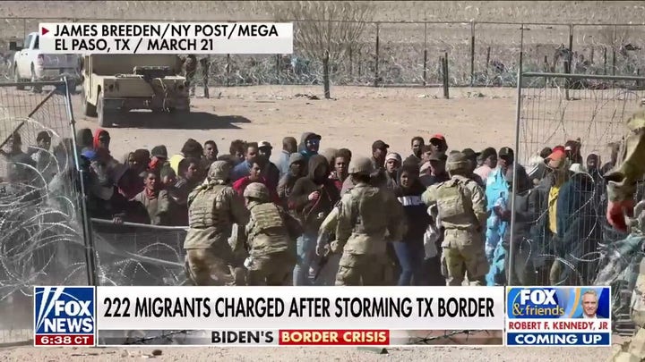 222 migrants charged with inciting a riot after storming border