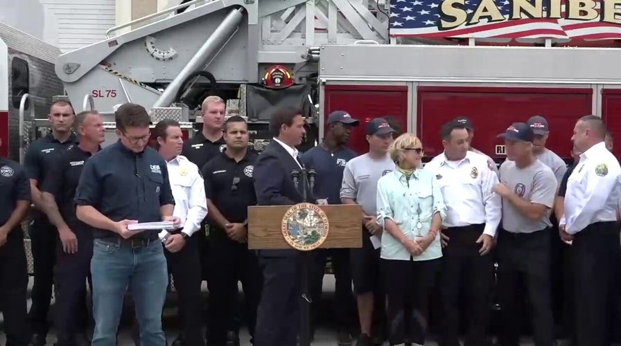 Florida Gov. Ron DeSantis hand delivers $1,000 bonus to first responders working Hurricane Ian response