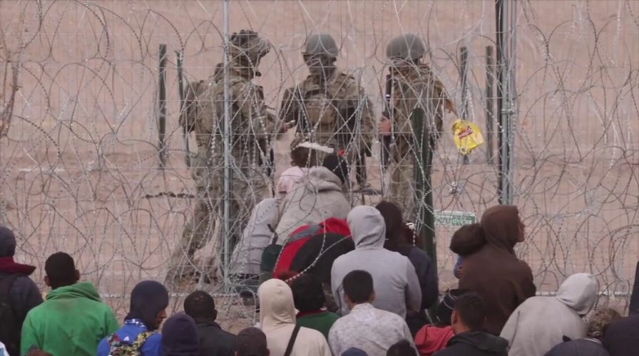 Migrant cuts razor wire at the border