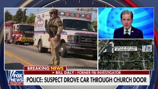 Suspected Michigan church shooter drove through door, police say