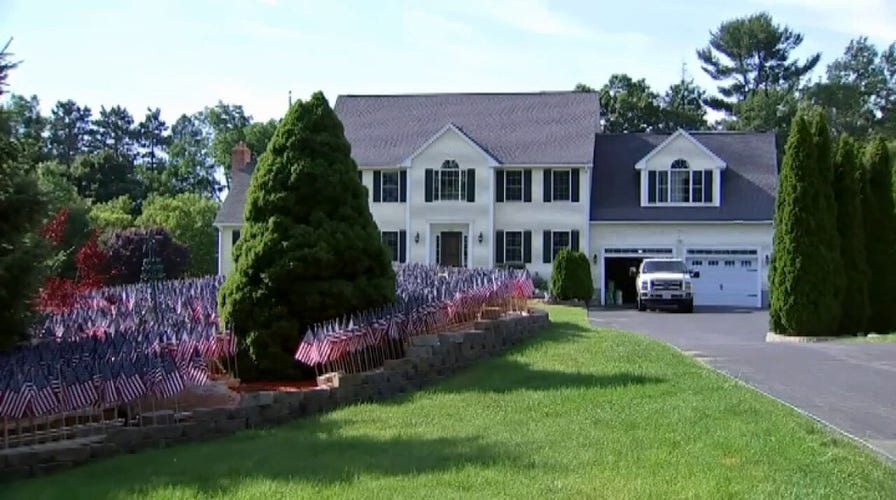 Flags at family home honors all Massachusetts COVID-19 deaths