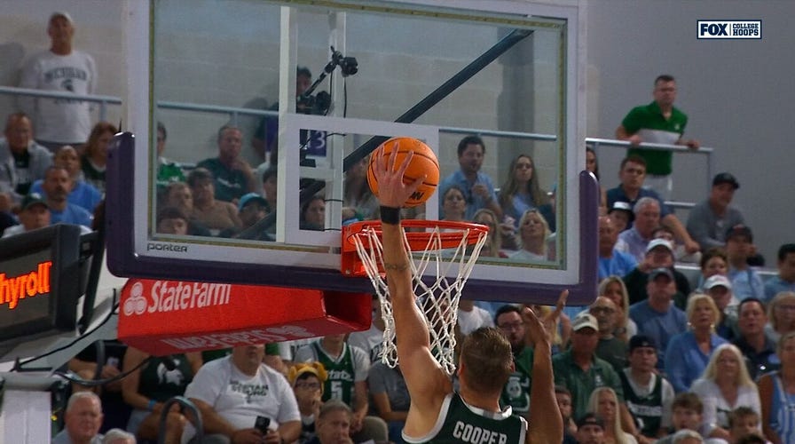 Michigan State's Carson Cooper hammers location  alley-oop slam vs. North Carolina