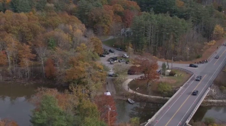 Drone video shows Maine river being searched in manhunt for Robert Card