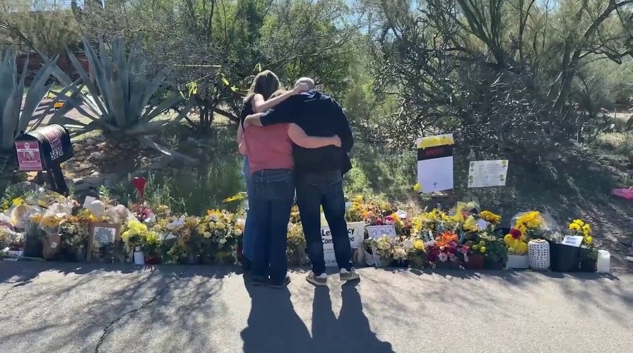 Guthrie family lays flowers outside Nancy Guthrie's home