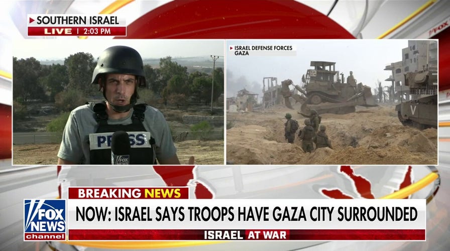 Israeli forces surround Gaza City as fighting rages
