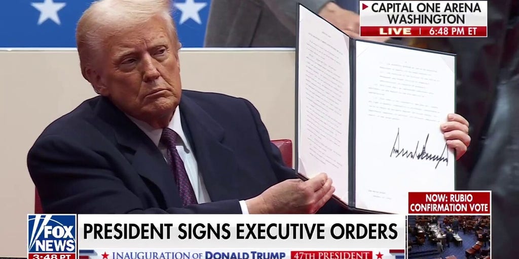 President Trump signs executive orders before supporters