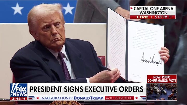  President Trump signs executive orders before supporters