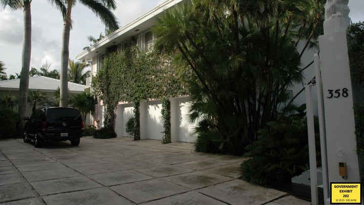 Authorities raid Jeffrey Epstein's Palm Beach mansion.