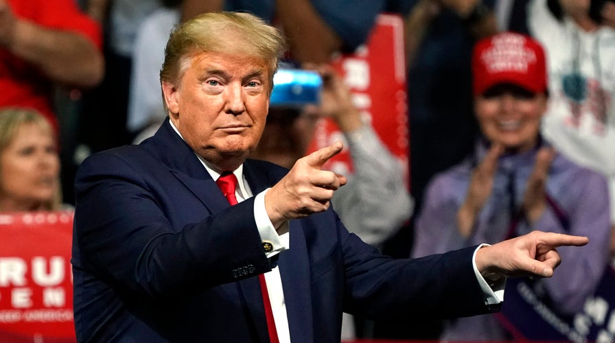 Trump rallies thousands of supporters in Arizona as Democrats take the debate stage in Nevada