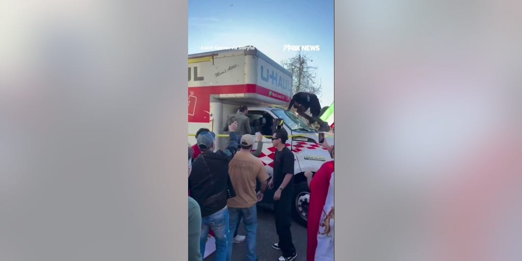 Demonstrators SWARM U-Haul after it drove through Iran protest