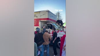 Demonstrators SWARM U-Haul after it drove through Iran protest