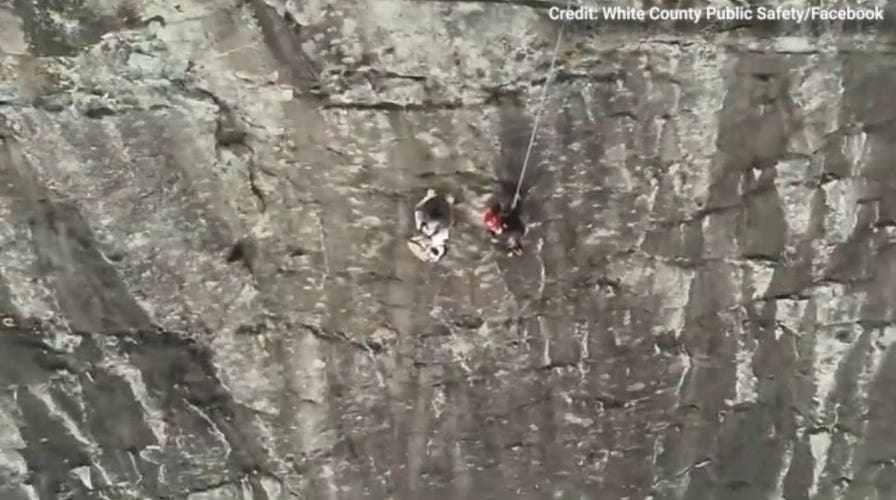 Free climber stranded on Georgia rock face calls 911, prompting dramatic rescue by firefighter