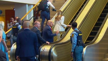 Several men seen going up UN escalator before Trump and first lady