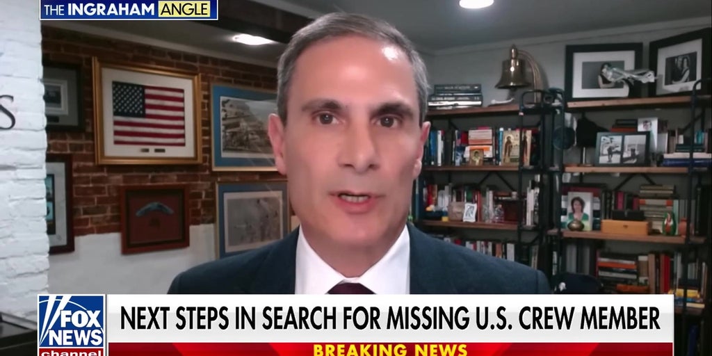 Search continues for missing American crew member as the sun rises in Tehran