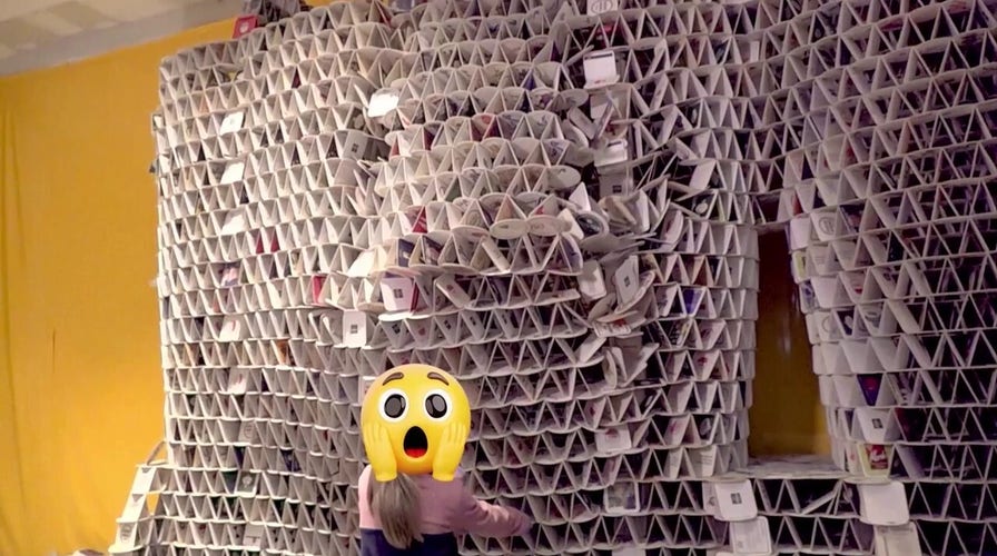 WATCH: Single pull sends massive beer-coaster tower crashing down