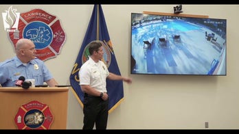 Surveillance video shows father and son saving 4-year-old boy from drowning in apartment complex's pool