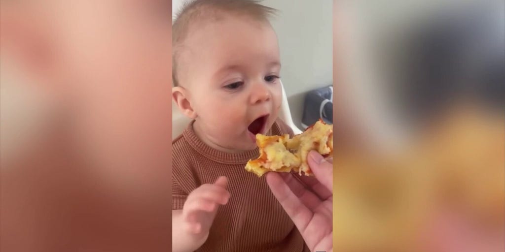 Baby takes first bite of pizza and her reaction is amazing