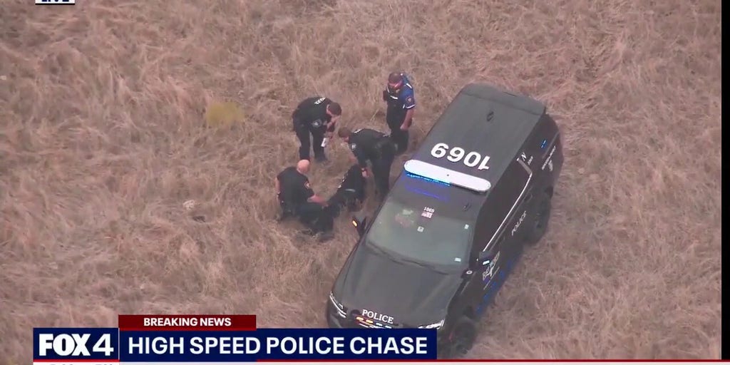 Texas police chase ends on foot after suspect flips over fence