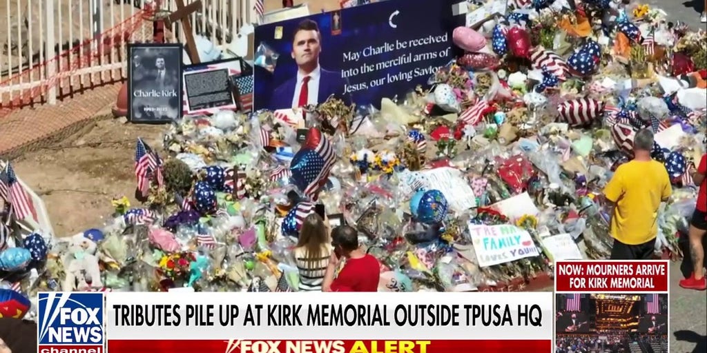 Tributes pile up at Charlie Kirk memorial outside TPUSA headquarters in Phoenix