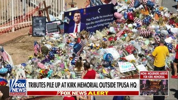 Tributes pile up at Charlie Kirk memorial outside TPUSA headquarters in Phoenix