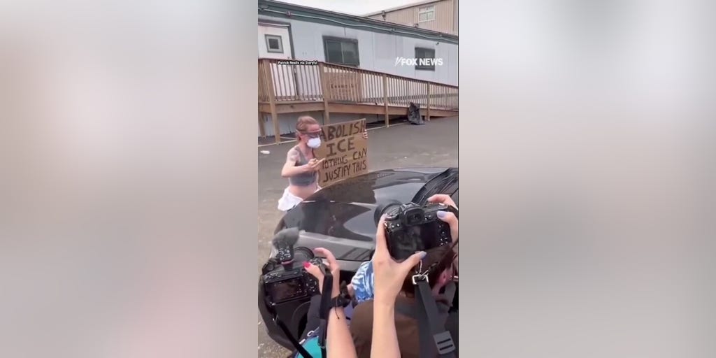 Anti-ICE agitator tries to BLOCK car entering Delaney Hall