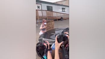 Anti-ICE agitator tries to BLOCK car entering Delaney Hall