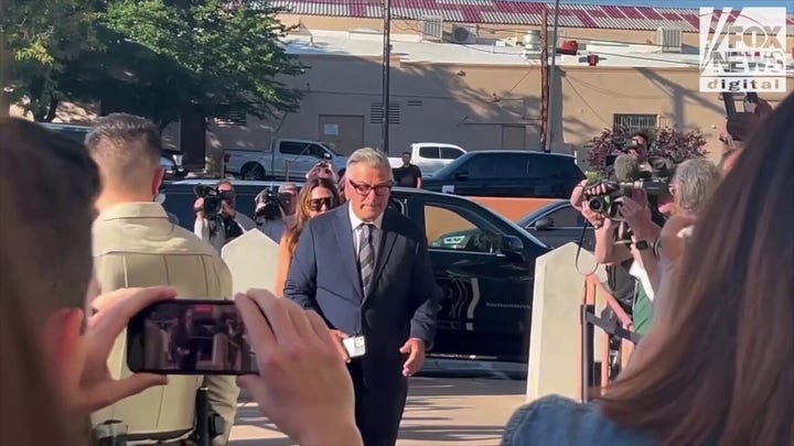 Alec Baldwin stays silent as he arrives for the second day of the 'Rust' movie shooting trial