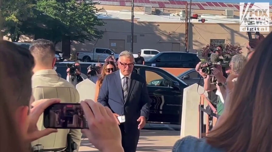 Alec Baldwin stays silent as he arrives for the second day of the 'Rust' movie shooting trial