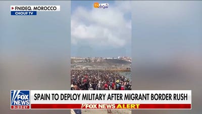Spain deploys military after thousands of migrants breach border