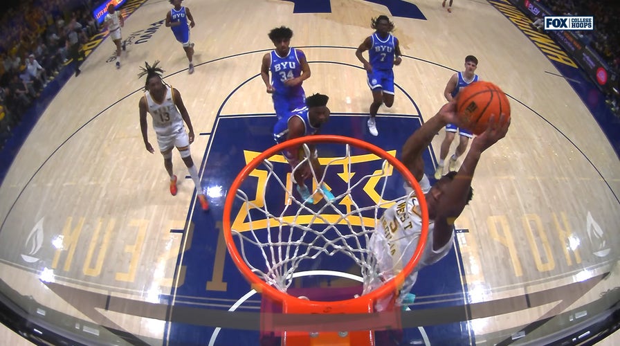 West Virginia's DJ Thomas throws down dunk, extending pb implicit BYU