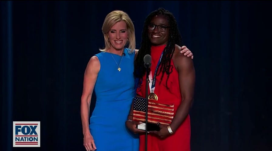 Olympic gold medalist Tamyra Mensah-Stock receives the award for Most Valuable Patriot at the 2021 Fox Nation Patriot Awards