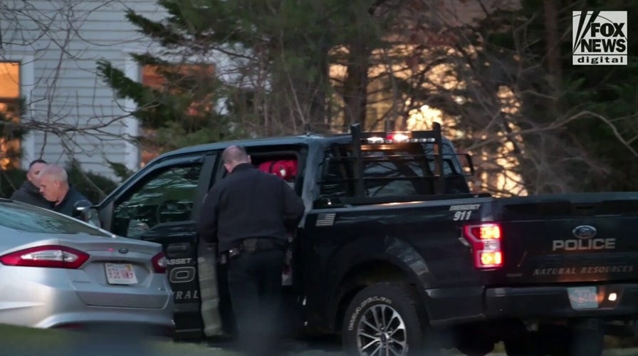 Police and investigators investigating the house of Brian Walshe after he and his children departed.