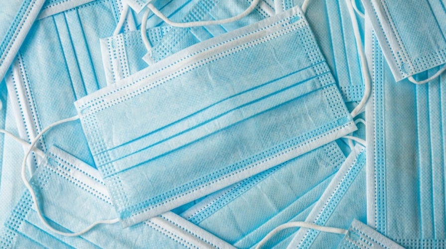 US hospitals revive mask mandates, some schools close as COVID cases surge