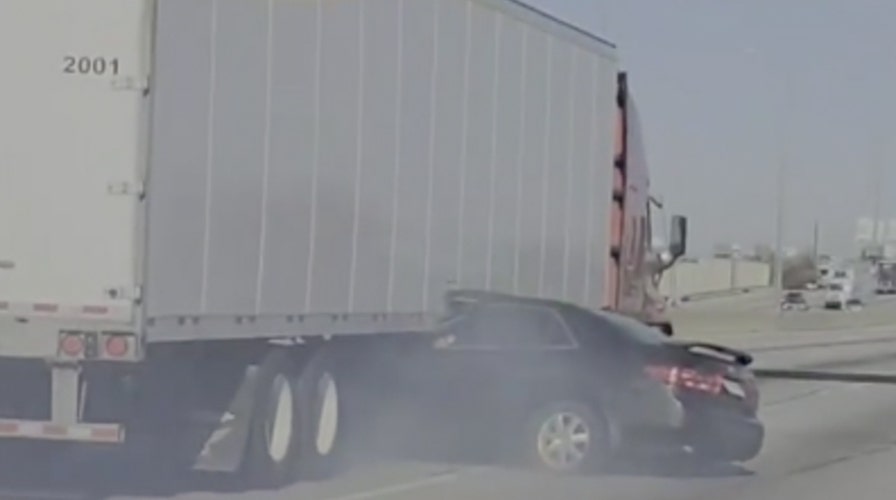 Tractor-trailer drags sedan down Illinois highway in jaw-dropping video