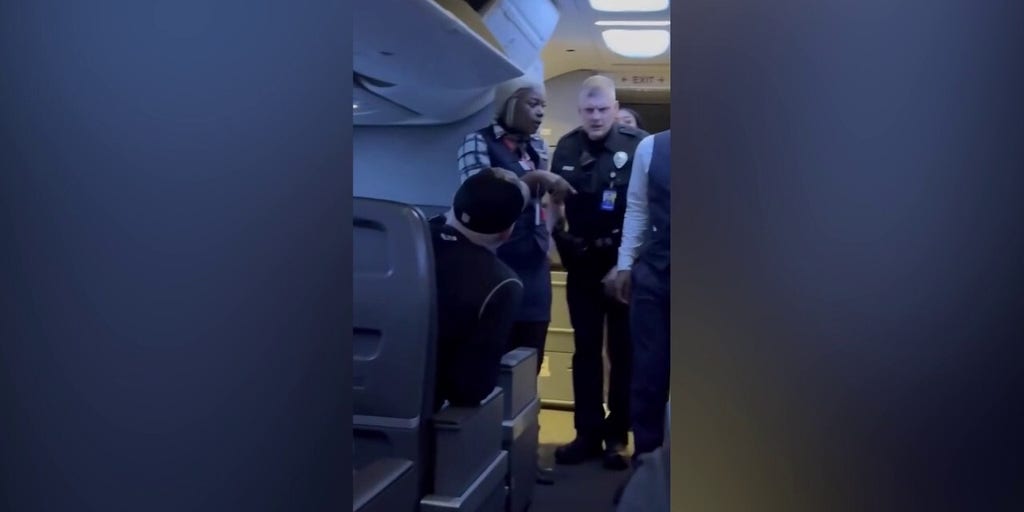 Passengers intervene when a man allegedly becomes violent with a woman seated next to him on a flight