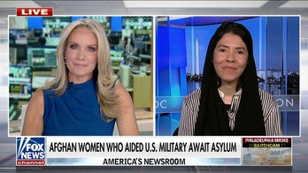 Afghan woman who aided US military await asylum 