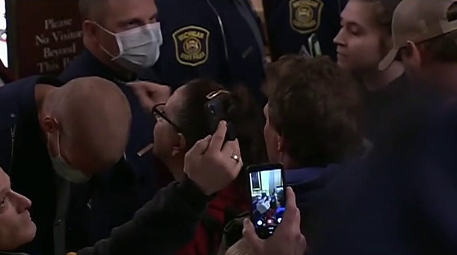 Armed protesters storm Michigan Capitol over stay-at-home orders