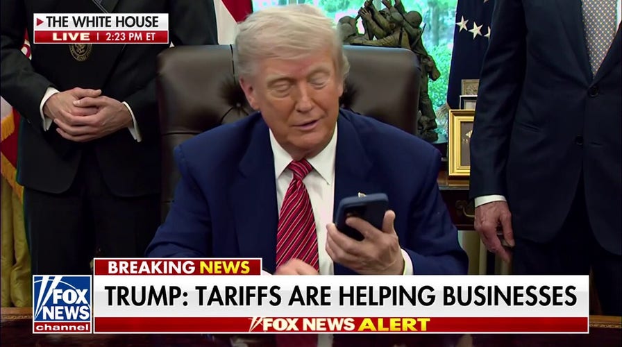  President Trump's phone goes off during executive order signing: 'It's only a congressman'
