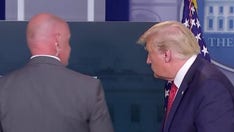 Trump abruptly escorted out of White House press briefing, returns to say there was a 'shooting' outside