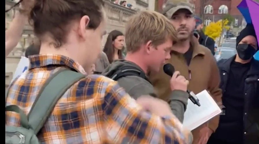 Leftist protesters harass man reciting Bible verses, take Bible and rip up pages, protester eats pages (Young America's Foundation)
