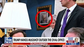 Trump proudly hangs 2023 mug shot outside the Oval Office