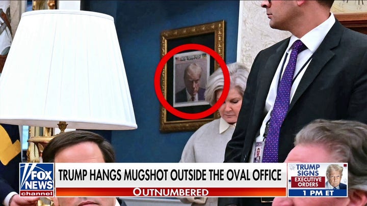 Trump proudly hangs 2023 mugshot outside the Oval Office