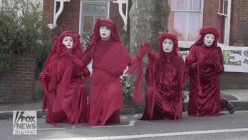 Mimes perform silent vigil to protest cutting down a 123-year-old tree