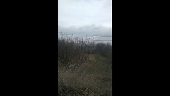 Choppers and shelling on the edge of Kyiv taken by local Ukrainian woman.