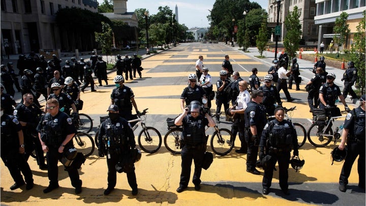 Officers clear protesters from outside the White House