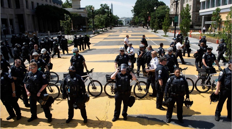 Officers clear protesters from outside the White House